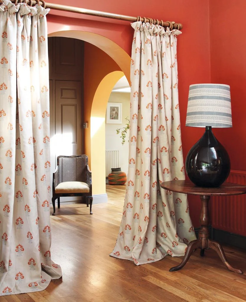 Orange hallway arched open doorway curtains 